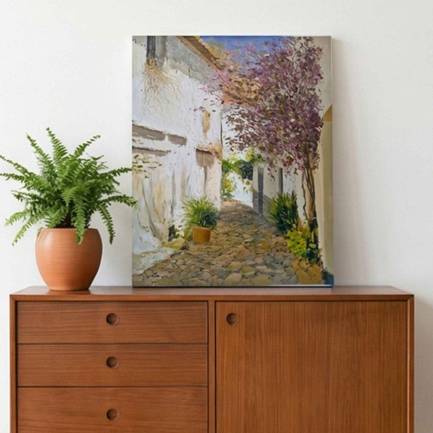 Pintura al óleo de calle andaluza con flores y paredes blancas